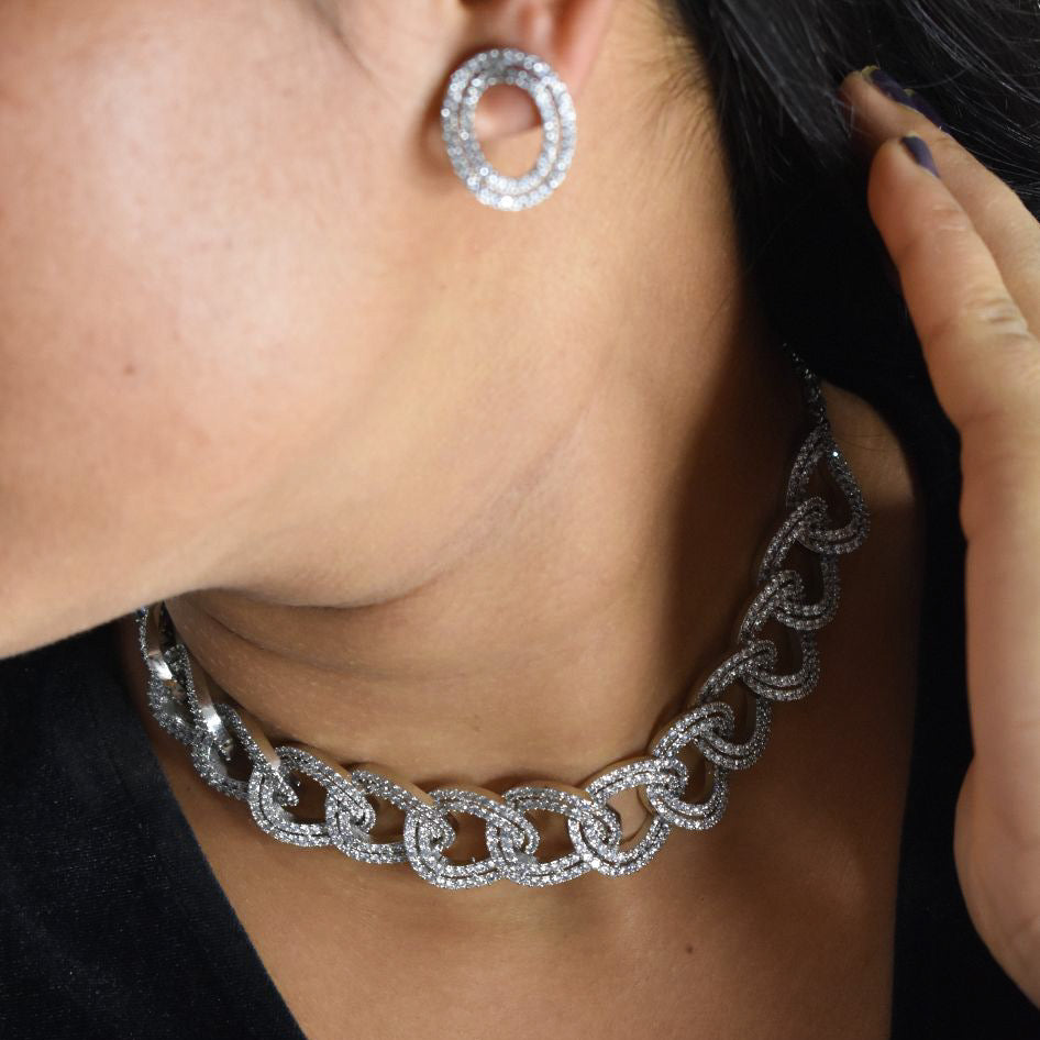 Catherine chain necklace with interlocked design and encrusted stones, paired with hoops